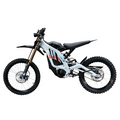 A white and black electric dirt bike with red and blue graphics on the frame, featuring knobby tires, a black seat, and a gold front fork, shown from a side profile on a white background.