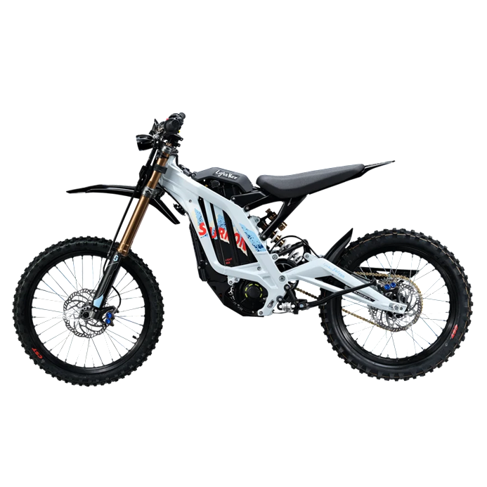 A white and black electric dirt bike with red and blue graphics on the frame, featuring knobby tires, a black seat, and a gold front fork, shown from a side profile on a white background.